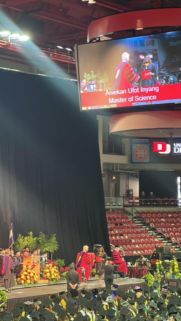 Photo of myself walking the graduation stage